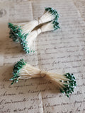 Off White Stamens with Green and Blue Tips
