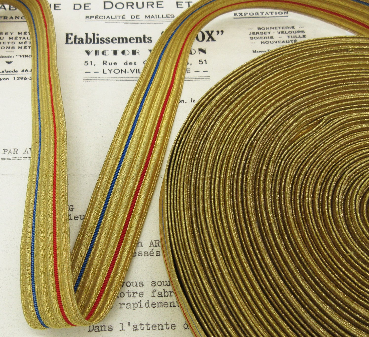 Gold Metallic w/Blue and Red Stripe Trim